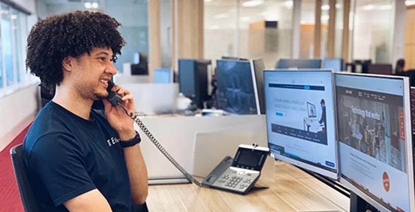 Premium coworking space at 17 State Street, New York, where professional staff handle client calls with care and efficiency.